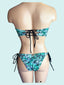 LAU DE LA - Sparkling Seashell Strapless Bandeau Top and Tie-side American Bottom with detailed embroidery and beading.